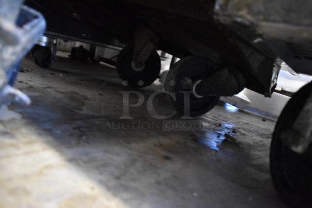 Southbend stainless steel range caster wheels on floor, showing commercial mobility feature.