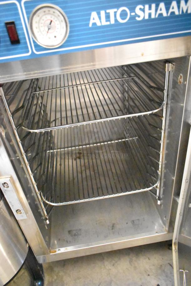 Alto Shaam 500-S stainless steel heated holding cabinet, includes racks and thermometer, on commercial casters, 125V, 1 phase.