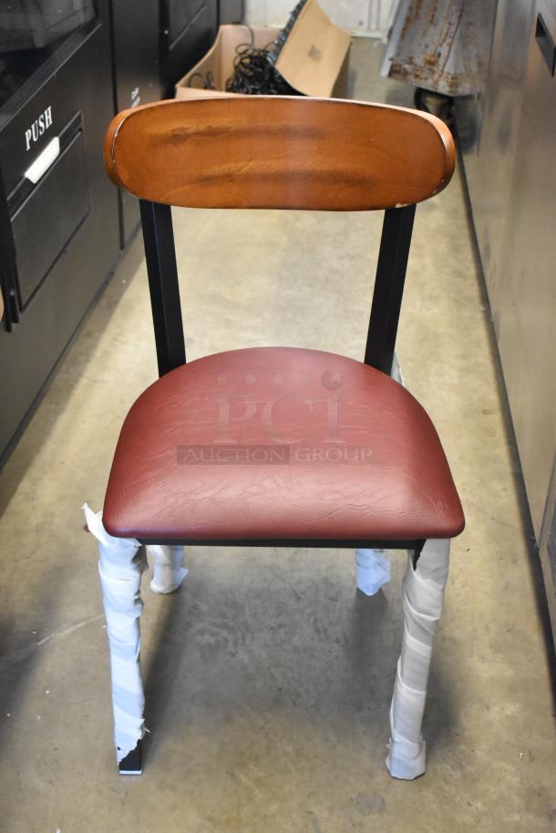 Brand new Lancaster dining chair, black metal frame, wooden back rest, maroon seat cushion, wrapped legs, scratch and dent condition.