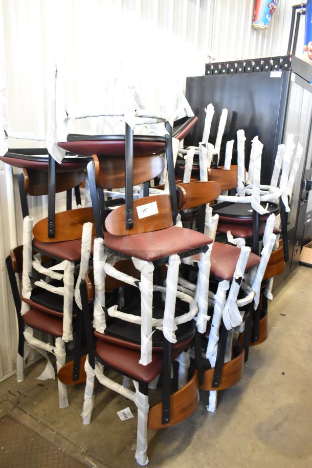 32 new Lancaster Table & Seating chairs, black metal frame, wooden backrest, maroon cushion. Scratch and dent condition.