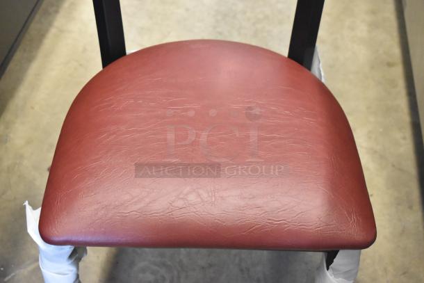 Lancaster Table & Seating black metal dining chair with wooden backrest and maroon seat cushion, scratch, and dent condition.