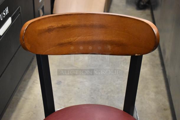 Lancaster black metal dining chair with wooden backrest, maroon seat cushion, slight scratches; brand new condition.