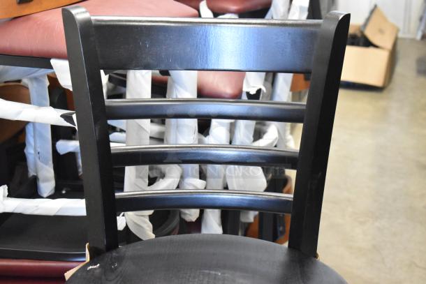 Black ladder back bar height chair by Lancaster Table & Seating, model 164BLADBLKFR, new condition, bundled in a lot of 14.