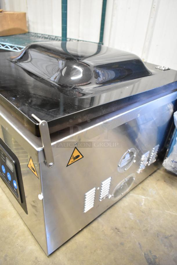 Stainless steel VacPak-It countertop vacuum sealer, brand new with minor scratches and dents, black top, control panel, safety stickers.