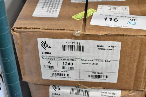 Three boxes, each containing six rolls of 1,240 Zebra labels, model Z-Perform 2000D, 4"x2", in good condition.