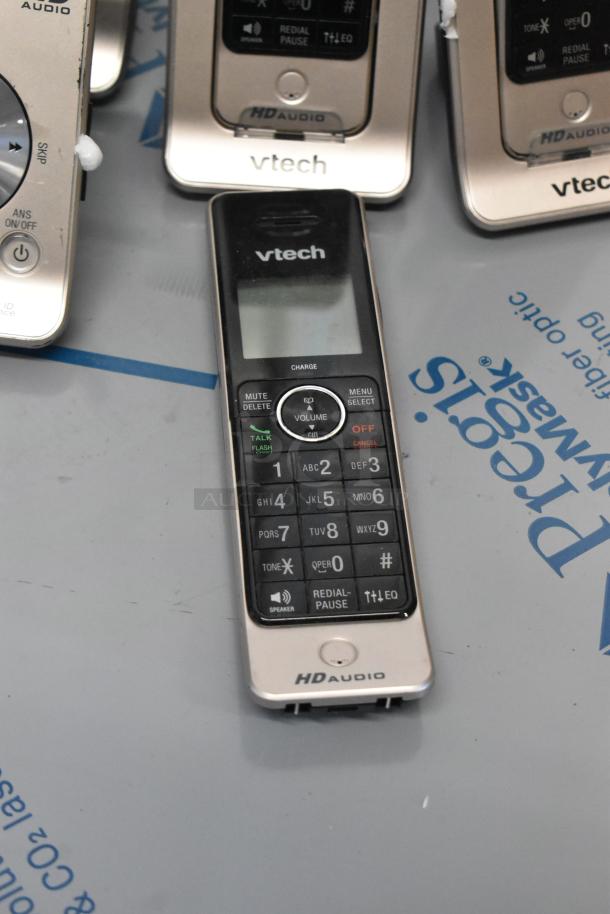 Vtech HD Audio phone set with base stations and handsets. Visible Vtech branding. In good condition.