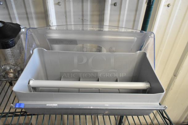 TableCraft paper roll dispenser and blender pitcher in good condition. Plastic dispenser with pull bar; pitcher with measurement markings.