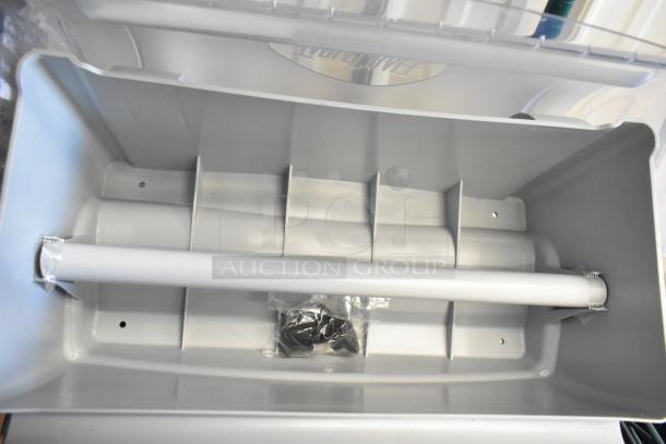 TableCraft paper product roll dispenser with compartments, white plastic, and included hardware, in excellent condition.