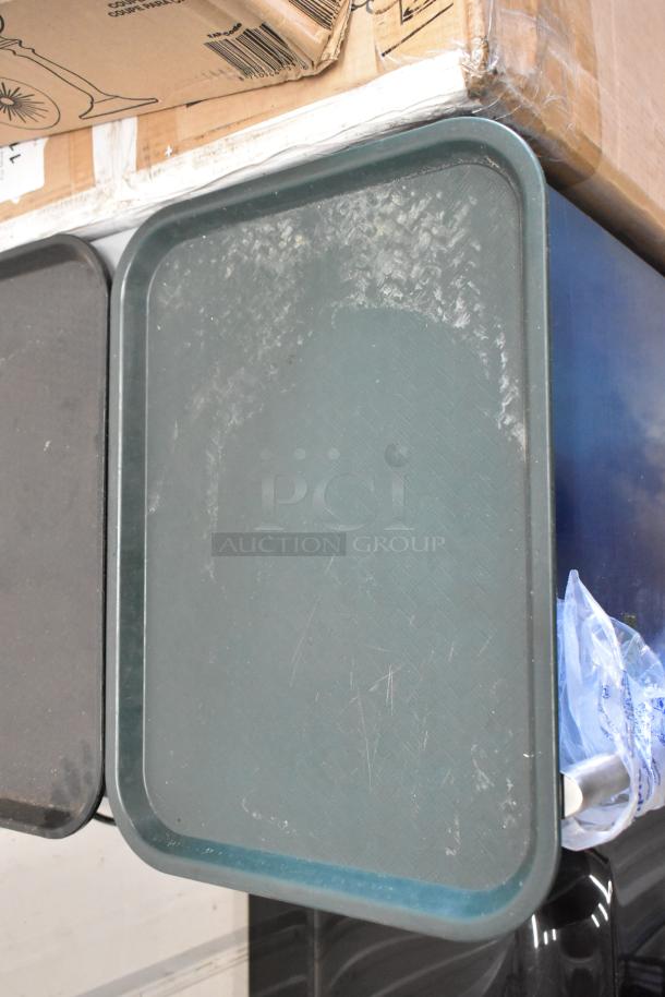 Green plastic food tray with textured surface, slight wear. Auction lot of 36. Rugged and versatile for food service.