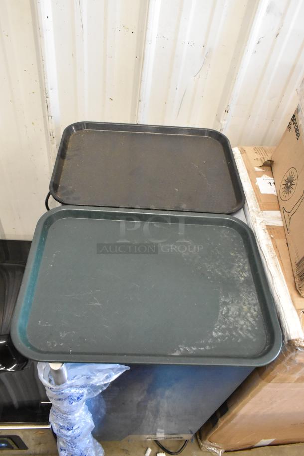 Set of 36 black poly food trays with minor wear. Durable and stackable, ideal for food service use.