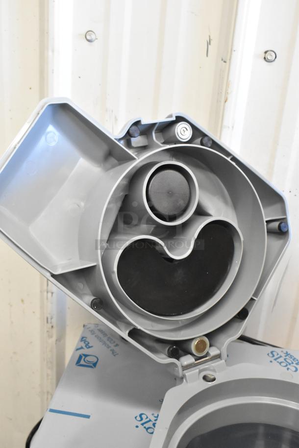 AvaMix food processor parts including a continuous feed head, grating blade, and slicing blade in good condition.