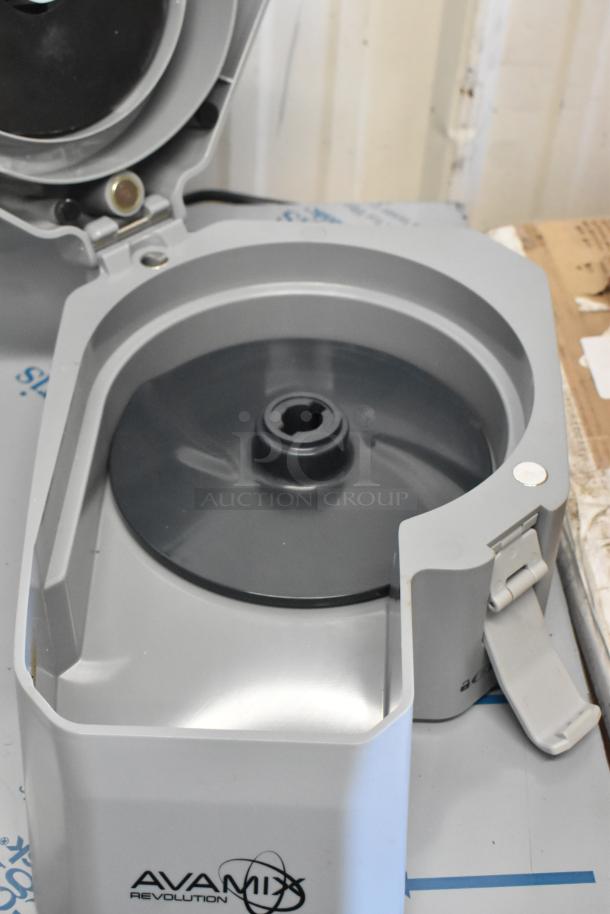AvaMix food processor parts, featuring a continuous feed head, grating blade, and slicing blade, in unused condition.