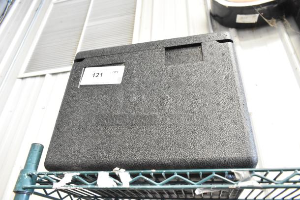 Cambro black insulated portable cooler in good condition, textured surface, visible label with quantity code "121."