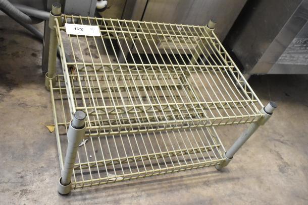2 Tier Wire Shelving Unit, metal, lightly weathered, sturdy construction, ideal for storage. Auction tag: 122.