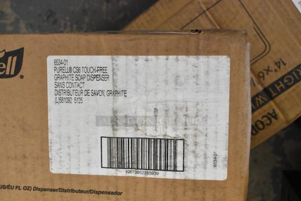 Purell 6534-01 automatic soap dispenser box with label details. Scratches visible, item condition is brand new, with original packaging.
