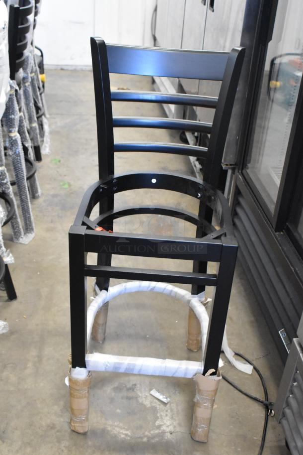 Brand new Lancaster Table & Seating 164BMTLADFRN black ladder back bar height chair frame, wrapped for protection.
