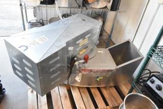 Brand new 2021 CaptiveAire CASRE13BD metal commercial power ventilator, industrial exhaust fan, silver finish, shown on wooden pallet.