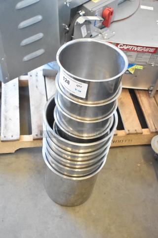 10 stainless steel cylindrical drop-in bins, stacked. Auction tag reads "QTY 10". In good condition.