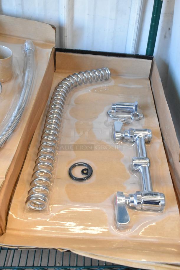 Brand new Regency 600PRD8X pre-rinse faucet, 1.15 GPM, deck-mounted, 8" centers, visible hose and fittings, minor scratches.