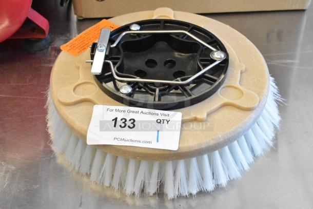 Brand new floor cleaning brush, scratch and dent condition. Features white bristles and black mounting plate with metal clamps.