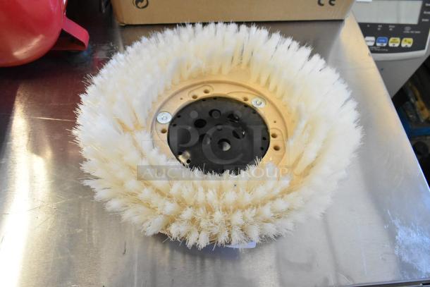 Brand new floor cleaning brush with robust white bristles. Scratch and dent present; sturdy plastic base. Ideal for efficient cleaning.