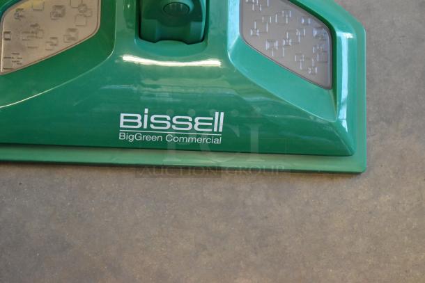 Brand new Bissell BGST1566 BigGreen Commercial Power Steamer, 115V, 1 Phase, minor scratches, green exterior, logo visible.