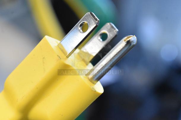 Close-up of yellow power plug for Bissell BGST1566 BigGreen Commercial Power Steamer, 115V, 1 Phase.