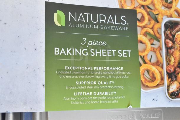 Nordic Ware Naturals 3-piece baking sheet set featuring 20 gauge aluminum pans with steel rim, new condition, includes wire rack.