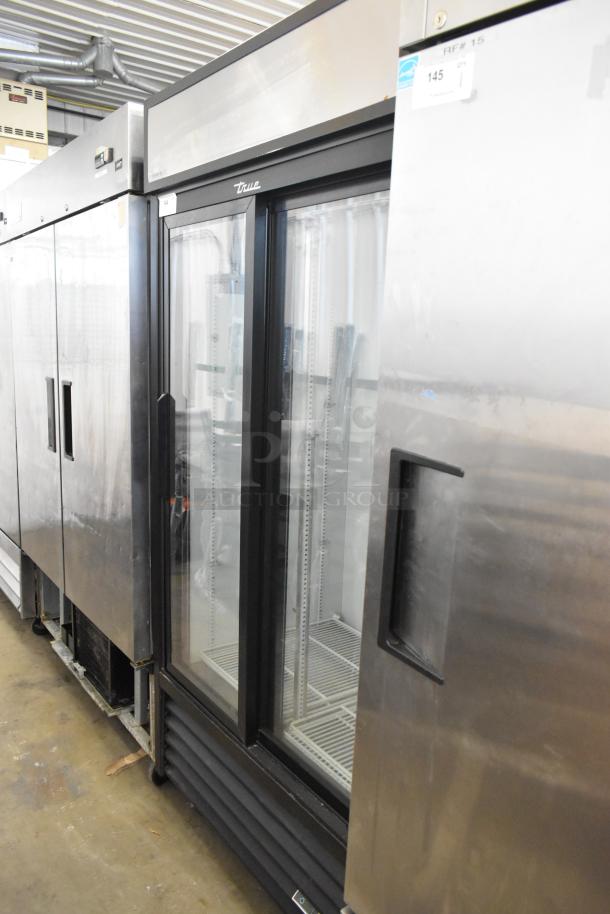 2019 True GDM-33-HC-LD 2-door reach-in cooler, poly-coated racks, commercial casters, 115V, 1 phase, metal exterior.