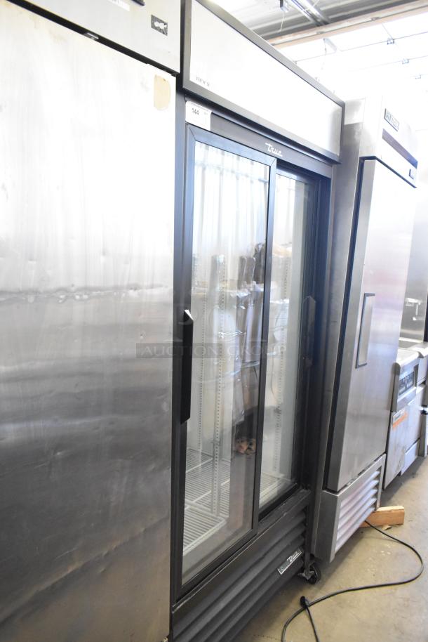 2019 True GDM-33-HC-LD commercial cooler, 2 glass doors, poly-coated racks, on casters, 115V, 1 Phase.