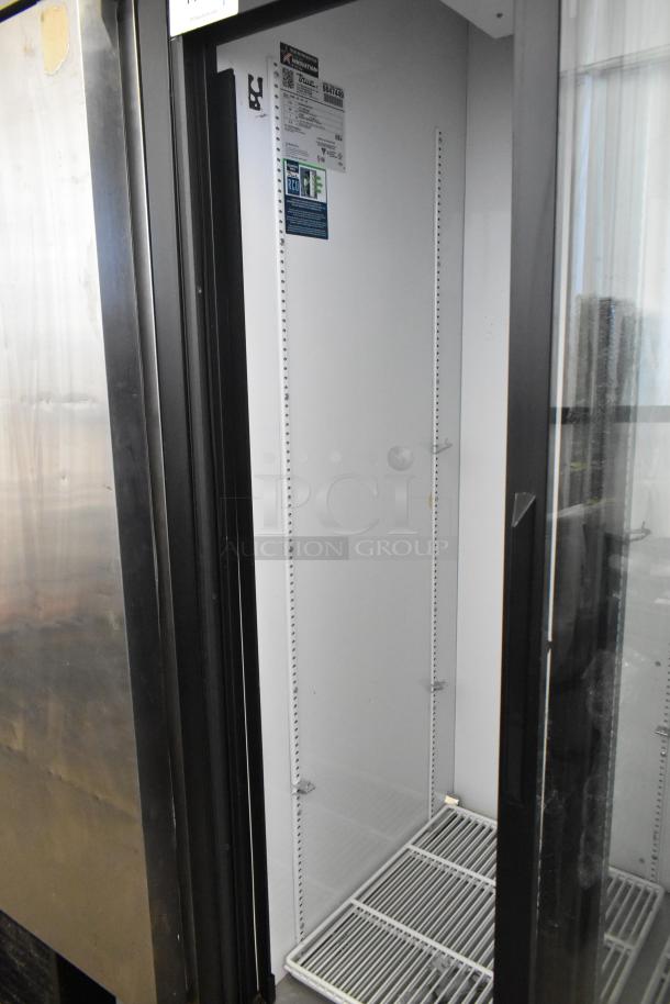 True GDM-33-HC-LD 2 Door Commercial Cooler, metal finish, poly-coated racks, commercial casters, 115V, 1 phase, tags visible.