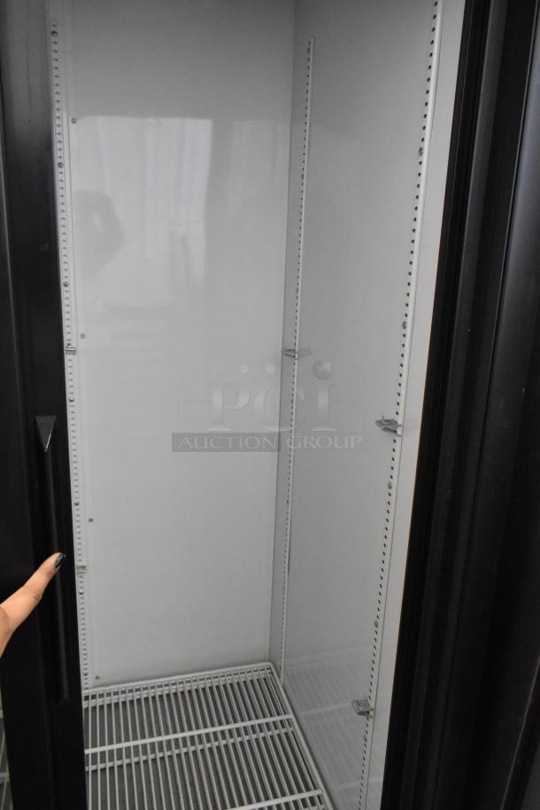 2019 True GDM-33-HC-LD commercial 2-door cooler, poly-coated racks, commercial casters, 115 volts, 1 phase, excellent condition.