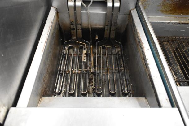 Frymaster RE114TCSC stainless steel electric fryer, 208 volts, 3 phase, with visible heating elements. Used condition.