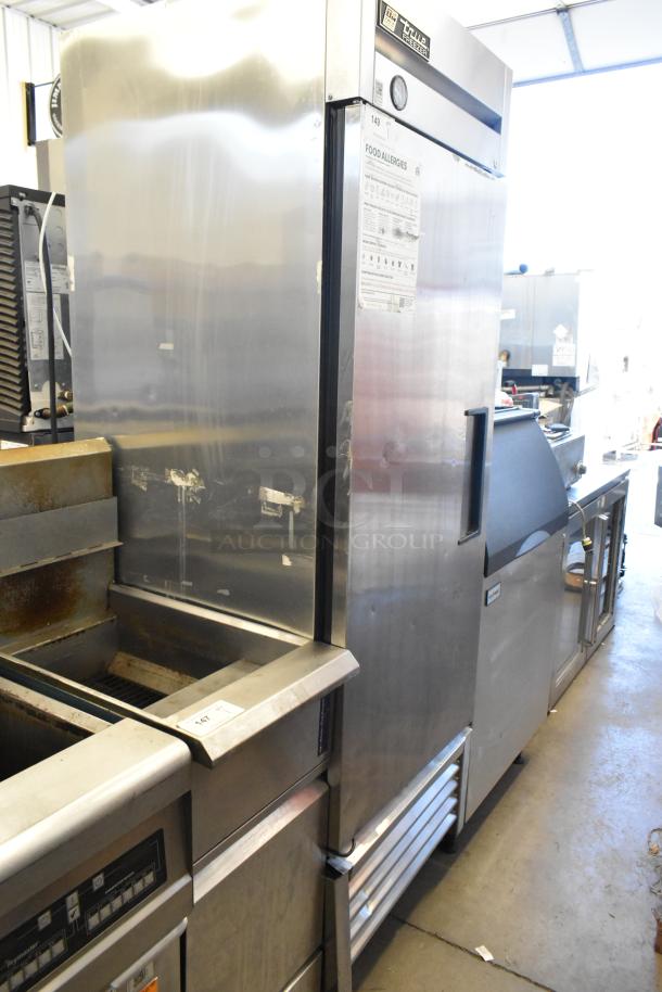 True T-23F stainless steel commercial freezer with single door and poly-coated racks on casters, 115V, 1 phase.
