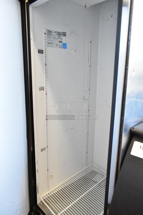 True T-23F stainless steel commercial freezer, single door, poly coated racks, 115V, 1 phase, on casters, interior label.