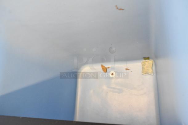 2023 Ice-O-Matic B55PSC Stainless Steel Ice Bin, 30-inch, 510 lbs capacity. Interior view with minor debris, drain plug visible.