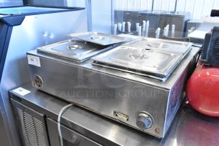Wells TMPT stainless steel countertop food warmer, 120V, single phase, with dual controls and visible wear.
