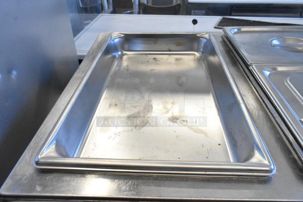 Wells TMPT Stainless Steel Commercial Countertop Food Warmer. Features 120 volts, 1 phase. Visible signs of use.