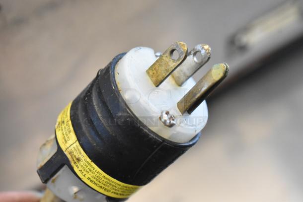 Power plug for Wells TMPT Stainless Steel Commercial Countertop Food Warmer, 120 Volts, 1 Phase; shows condition and labeling.