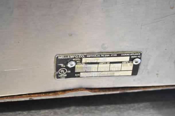 Wells TMPT stainless steel commercial countertop food warmer, 120 volts, 1 phase. Features a UL label with specifications.