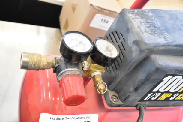 Central Pneumatic 100 PSI 3 Gallon 1/3 HP Air Compressor, red, gauge and valve visible, 115V, light wear.