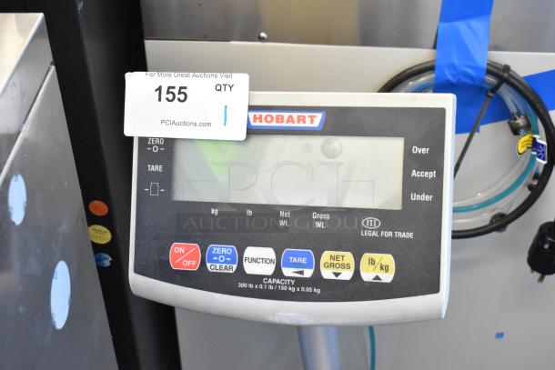 Hobart RW Metal Scale, digital display, brand markings, function buttons, capacity 300 lb/150 kg, legal for trade.