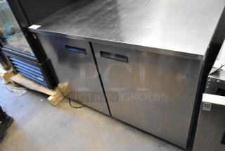 Delfield stainless steel 2-door undercounter cooler on casters, 115V, 1 phase, in good condition.