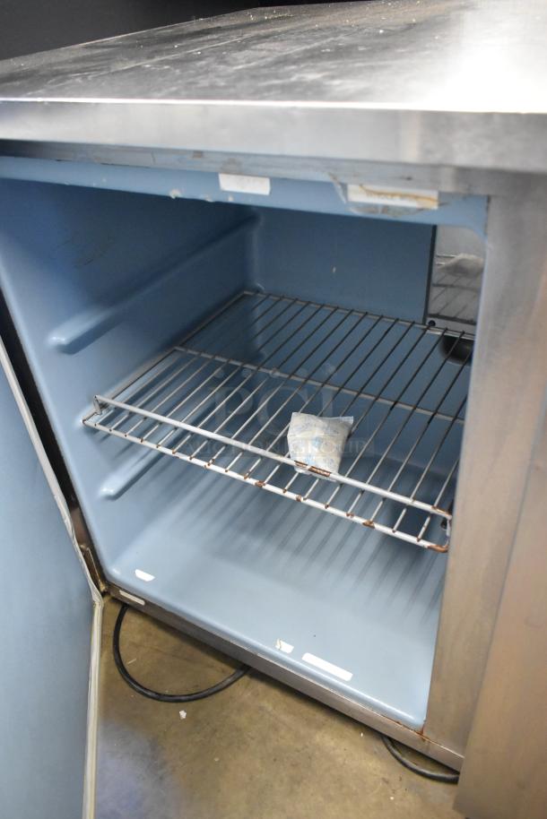 Delfield stainless steel 2-door undercounter cooler on casters. Features wire shelf, 115 volts, 1 phase. Commercial use.