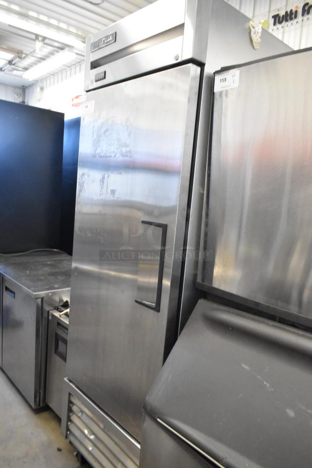 2019 True T-23F-HC stainless steel commercial freezer, single door, poly-coated racks, on casters; 115V, 1 phase.