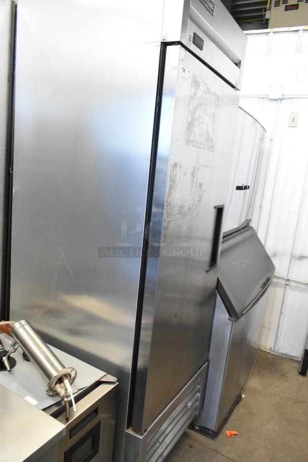 2019 True T-23F-HC stainless steel commercial reach-in freezer, single door, poly-coated racks, on casters, 115V, 1 phase.