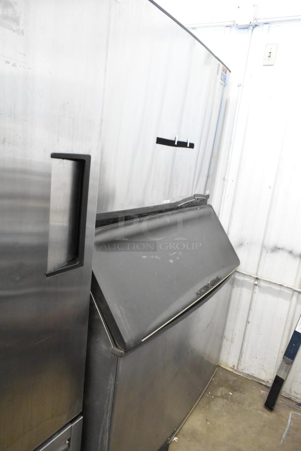 Manitowoc SD1802A stainless steel commercial ice head on bin. 208-230V, 1 phase. Good condition, minor wear visible.