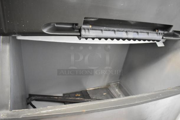 Manitowoc SD1802A stainless steel ice head on bin; commercial use, 208-230V, 1 phase, robust construction, clean interior.