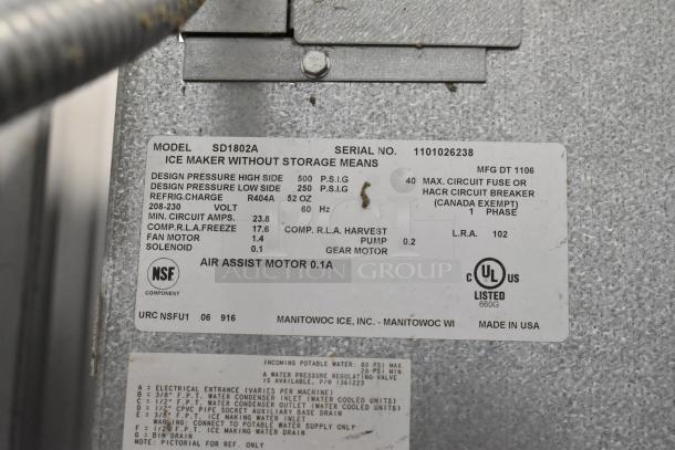 Manitowoc SD1802A stainless steel commercial ice maker head, 208-230 volts, 1 phase, with technical specifications label.