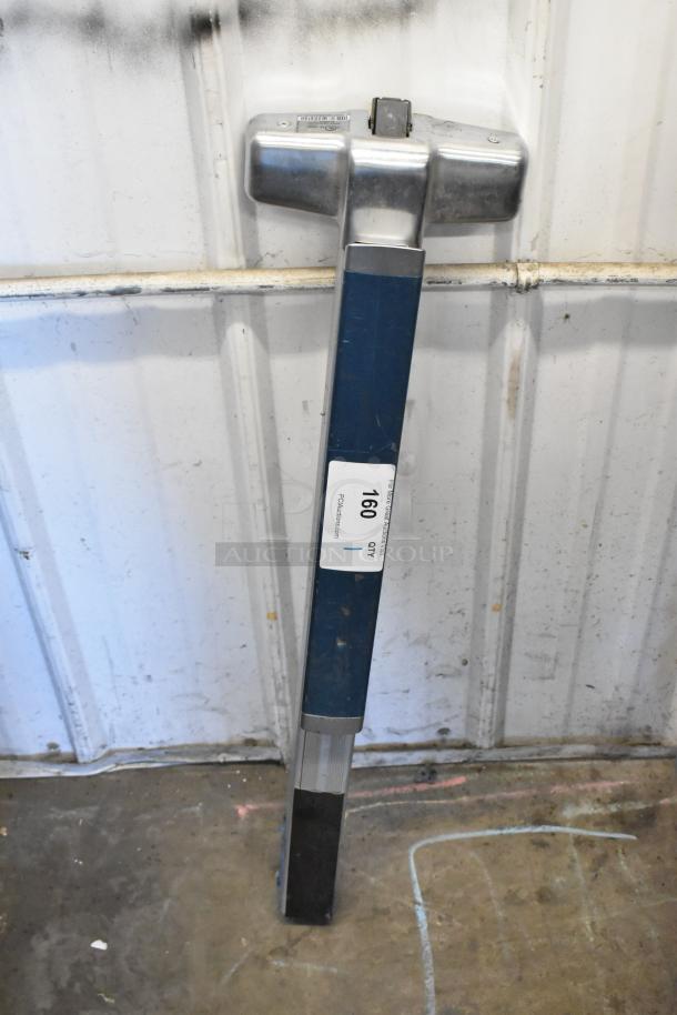 Metal door push bar with blue and silver finish, in used condition. Visible ID label with "160 QTY."